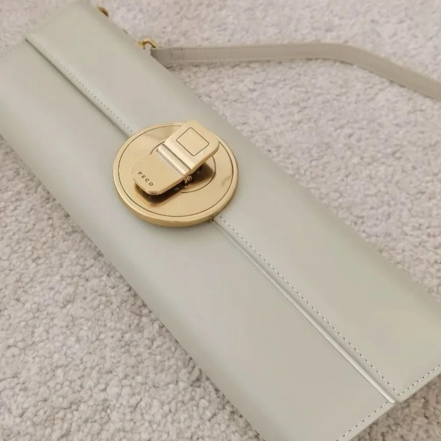 The Royale Gold Emblem Clutch Purse